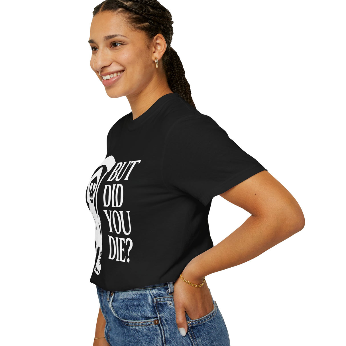 Person wearing a black t-shirt with text, standing against a white background