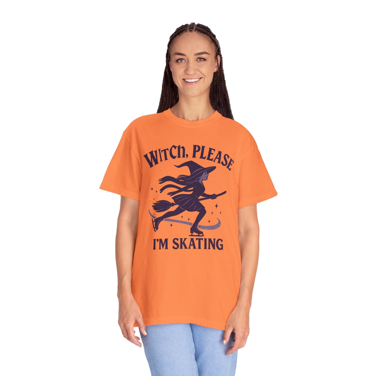 Person wearing an orange t-shirt with a witch graphic and text on a white background