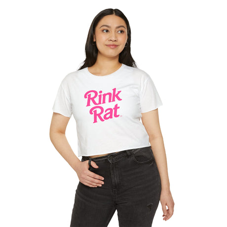 Person wearing a white t-shirt with 'Rink Rat' in pink text on a white background