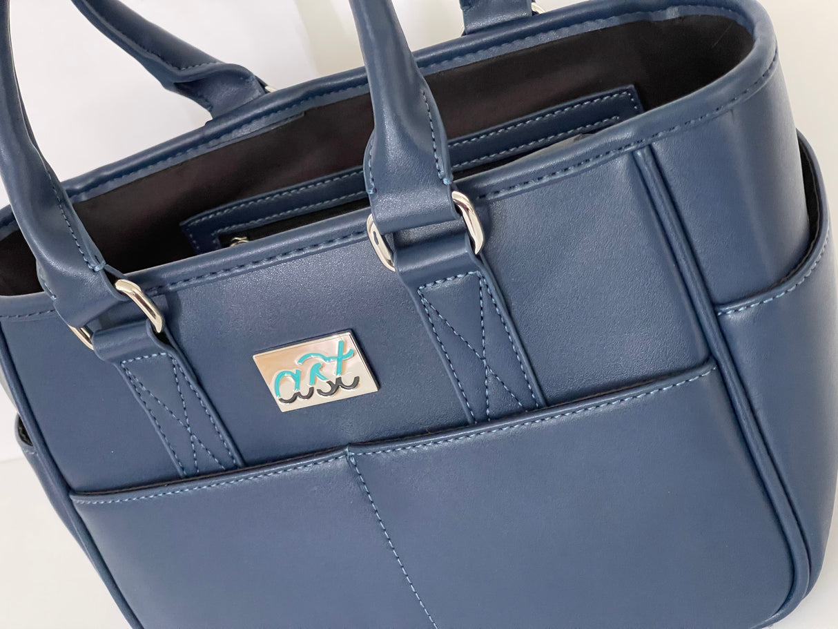 Blue handbag with a visible brand logo on a white background