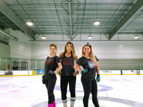 Three adult skaters in Adults Skate Too tees standing on the ice