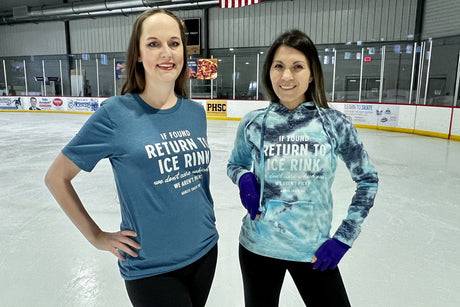 Two adult skaters in Adults Skate Too tops standing together on the ice