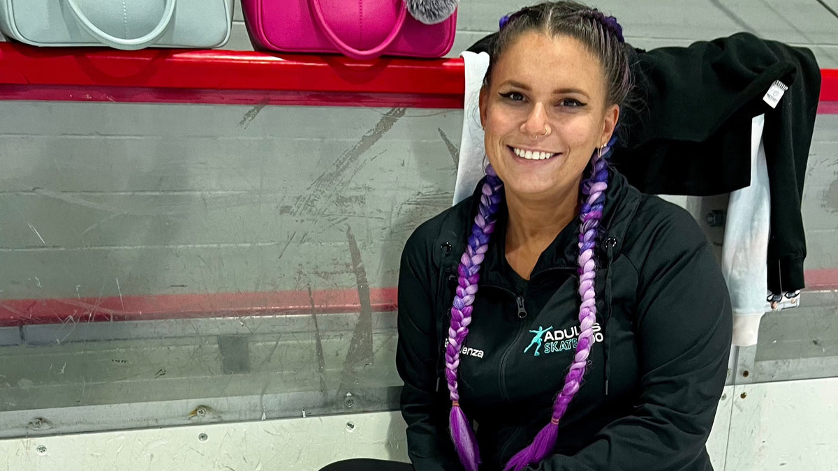 A skater in a black jacket sitting on a bench by the boards after a session