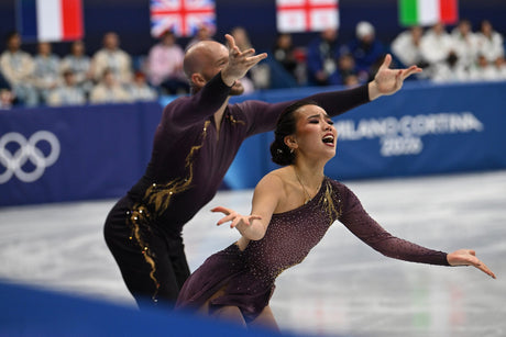 Ellie Kam and Danny O'Shea compete in the pairs short program of the team event at the 2026 Winter Olympics in Milano Cortina.