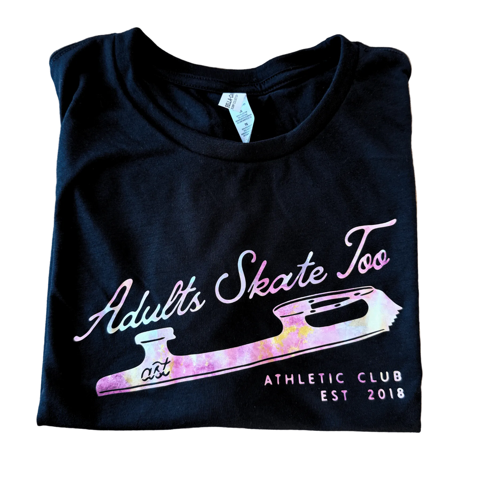 Folded navy tee with the Adults Skate Too Athletic Club blade print in pastel holographic tones