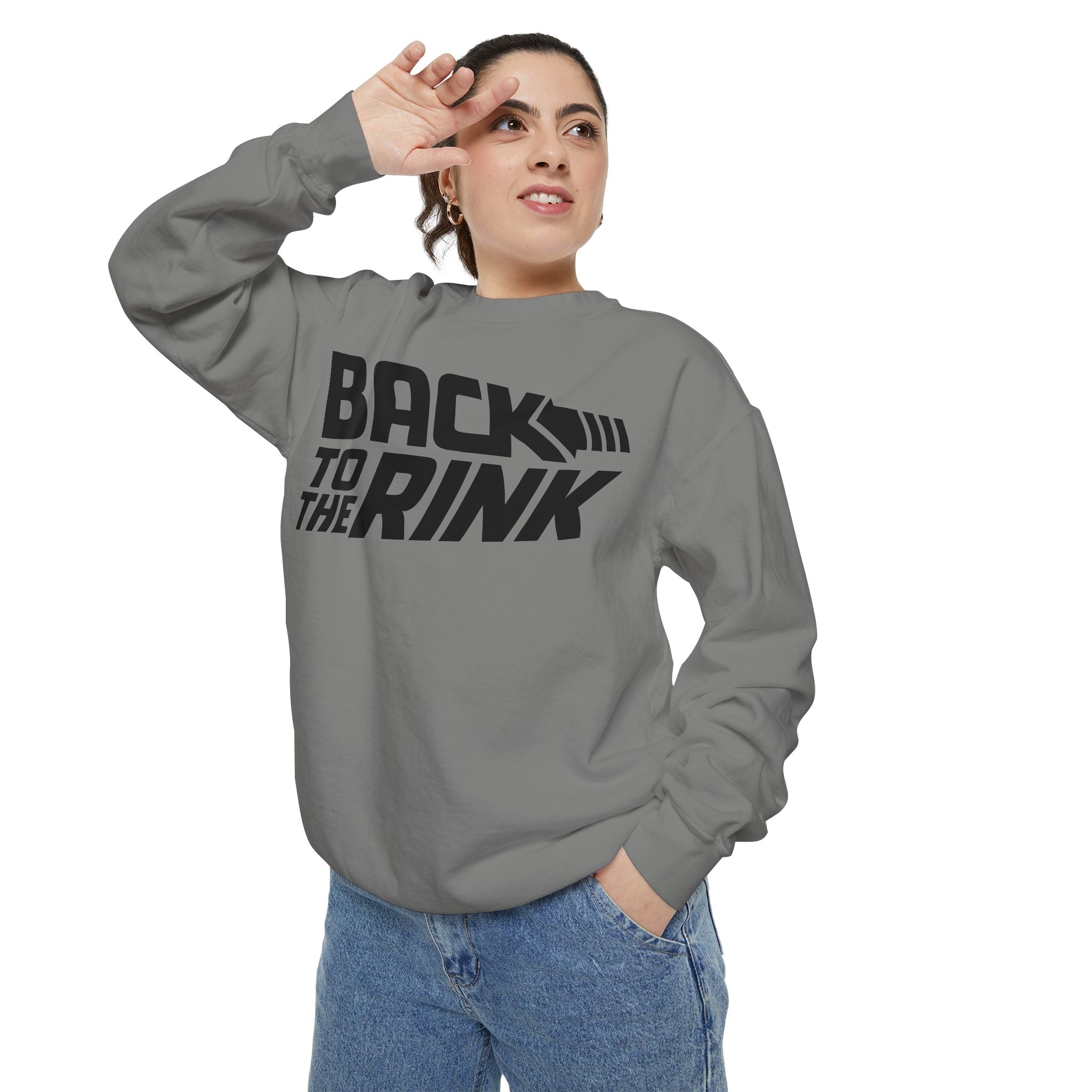 Person wearing a gray sweatshirt with 'Back to the Rink' text on a white background