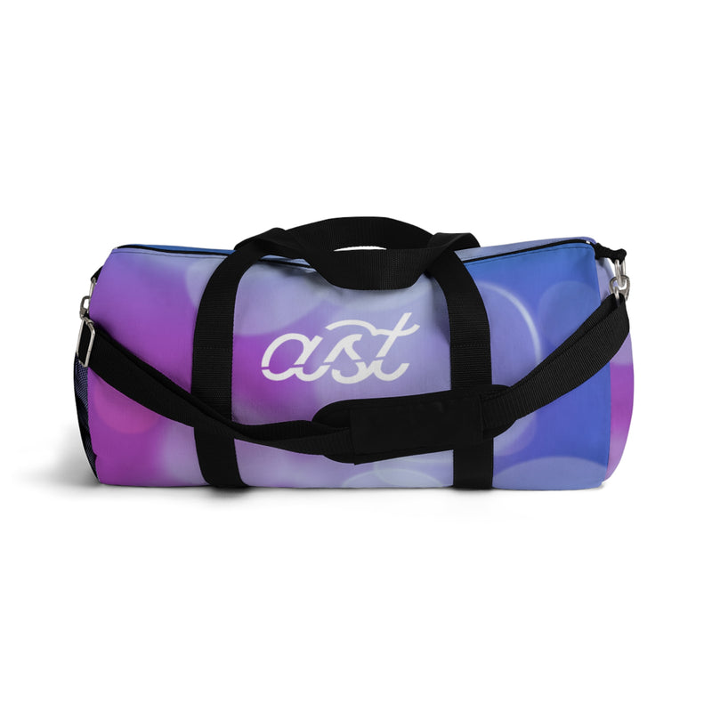 Multicolored duffel bag with 'ast' logo on a white background