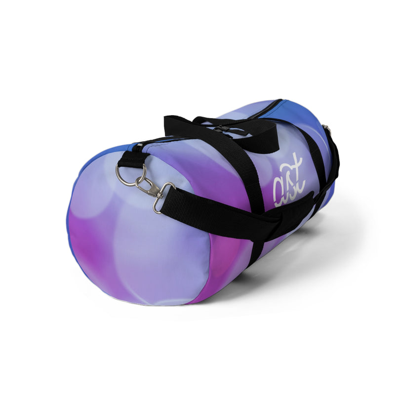 Purple and white duffel bag with black straps on a white background