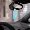 Car air freshener hanging from a car's rearview mirror with a blurred background