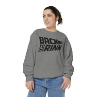 Person wearing a gray sweatshirt with 'Back to the Rink' text on a white background