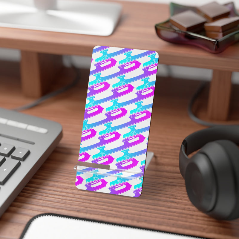 Colorful phone case with geometric pattern on a desk with keyboard and headphones