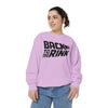 Person wearing a light purple sweatshirt with 'Back to the Rink' text on a white background
