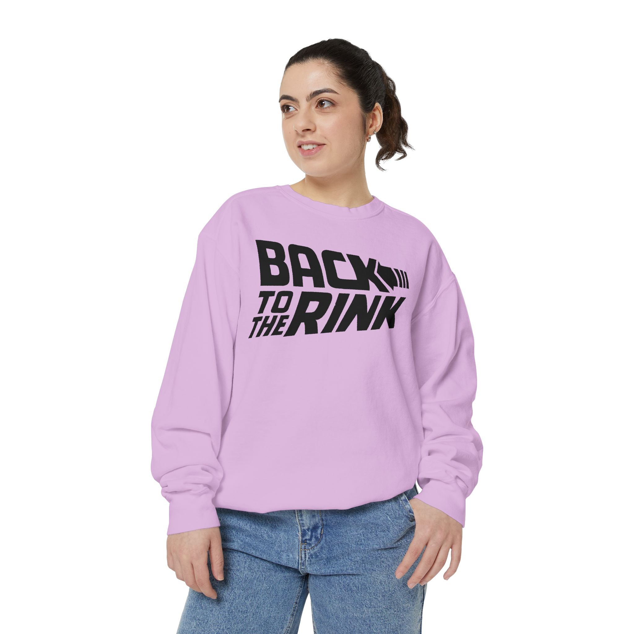 Person wearing a light purple sweatshirt with 'Back to the Rink' text on a white background