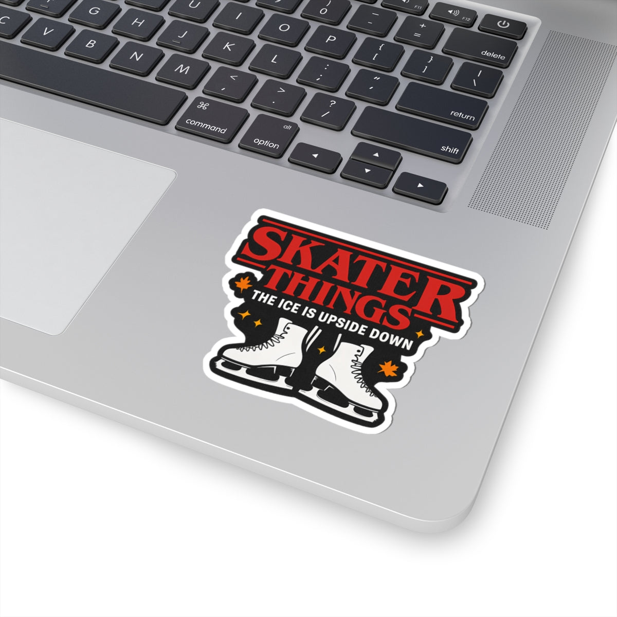 Laptop with a 'Skater Things' sticker on the palm rest area
