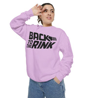 Person wearing a light purple sweatshirt with 'Back to the Rink' text on a white background