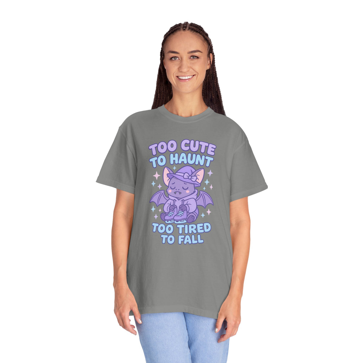 Person wearing a gray t-shirt with a purple graphic and text on a white background