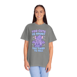 Person wearing a gray t-shirt with a purple graphic and text on a white background