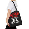 Person holding a black tote bag with red and white text and graphics.