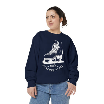 Person wearing a navy blue sweatshirt with ice skate design and text on a white background