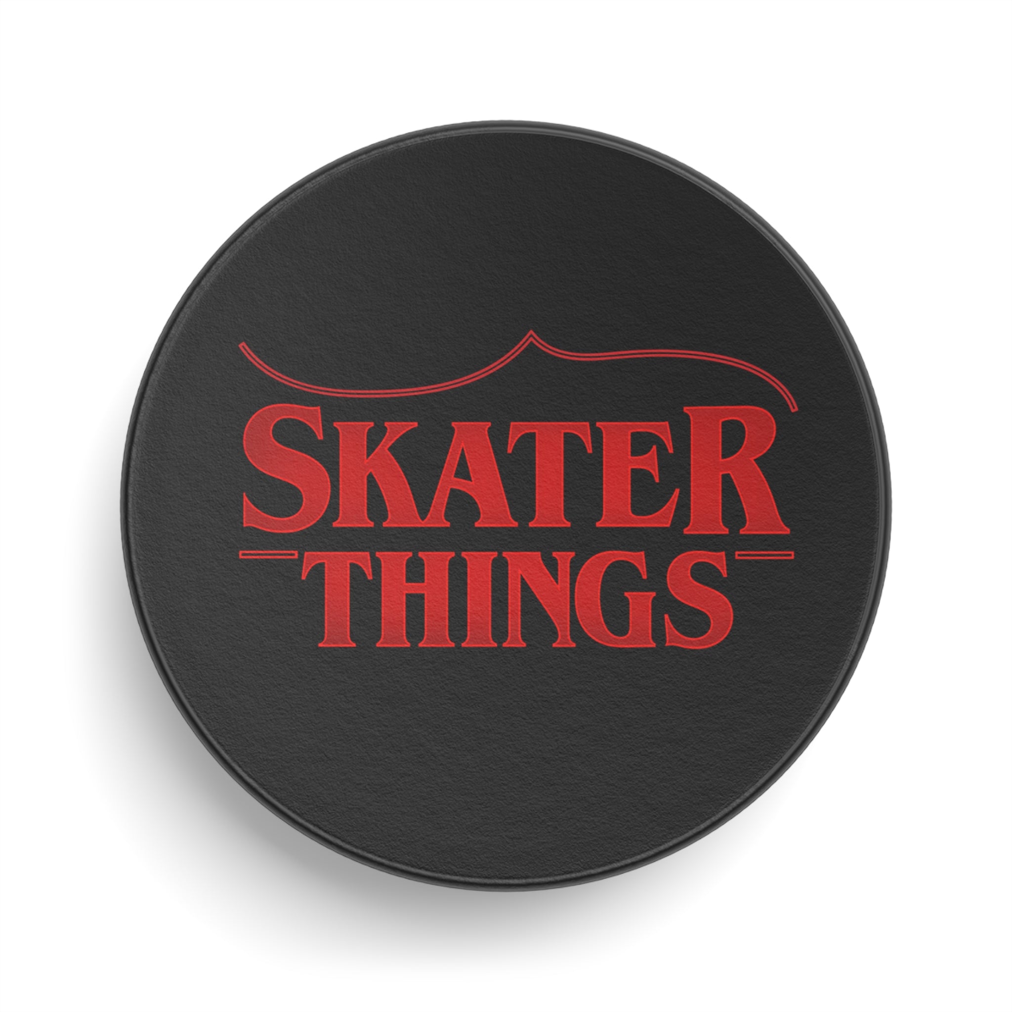 Black circular object with red text 'SKATER THINGS' on a white background