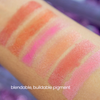 Color swatches on a person's arm with text 'blendable, buildable pigment'.