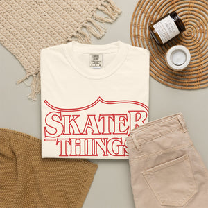 Skater Things T-Shirt in Ivory, folded on a flat lay with jeans