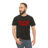 Man wearing a black t-shirt with 'Skater Things' in red text on a white background