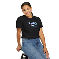 Person wearing a black 'ToePick' t-shirt sitting on a stool against a white background