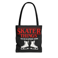Black tote bag with red and white text and ice skates on a white background
