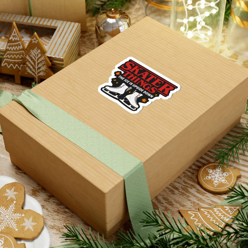 Wooden gift box with a 'Stranger Things' sticker on a festive background with cookies and decorations.