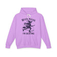 Purple hoodie with witch graphic and text on a white background