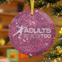 Pink glittery ornament with 'Adults Skate Too' text and silhouette of a skater, hanging on a Christmas tree.