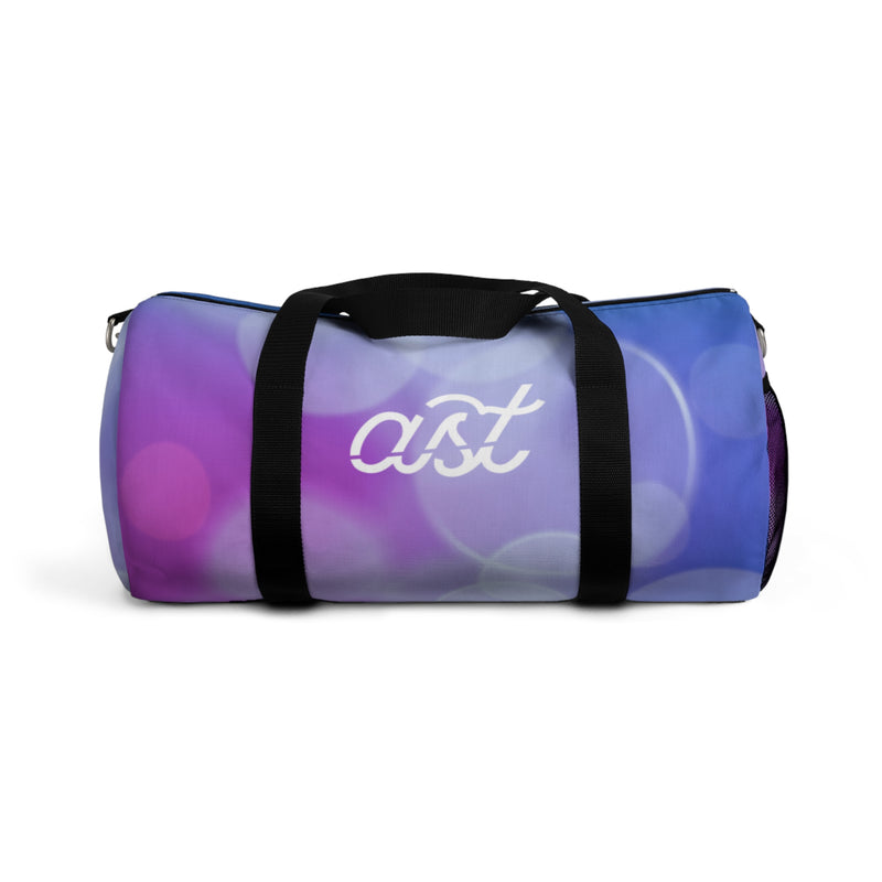 Purple duffel bag with black handles on a white background