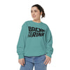 Person wearing a teal sweatshirt with 'Back to the Rink' text on a white background