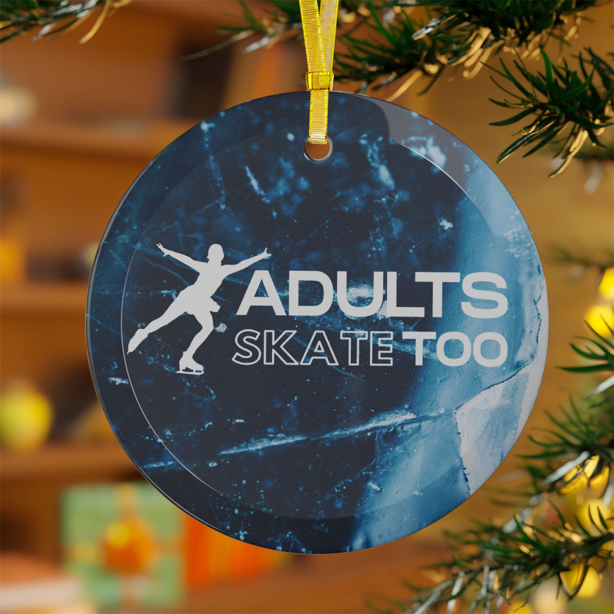 Decorative ornament with 'Adults Skate Too' text and silhouette of a person skateboarding, hanging on a Christmas tree.