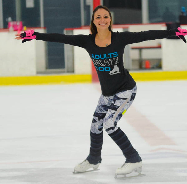 Skater in a black long-sleeve Adults Skate Too top gliding with her arms out
