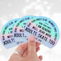 Three Bend Your Knees Club holographic stickers fanned out in a hand