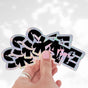 Three SKATE holographic stickers with skater silhouettes in the letters, fanned out in a hand