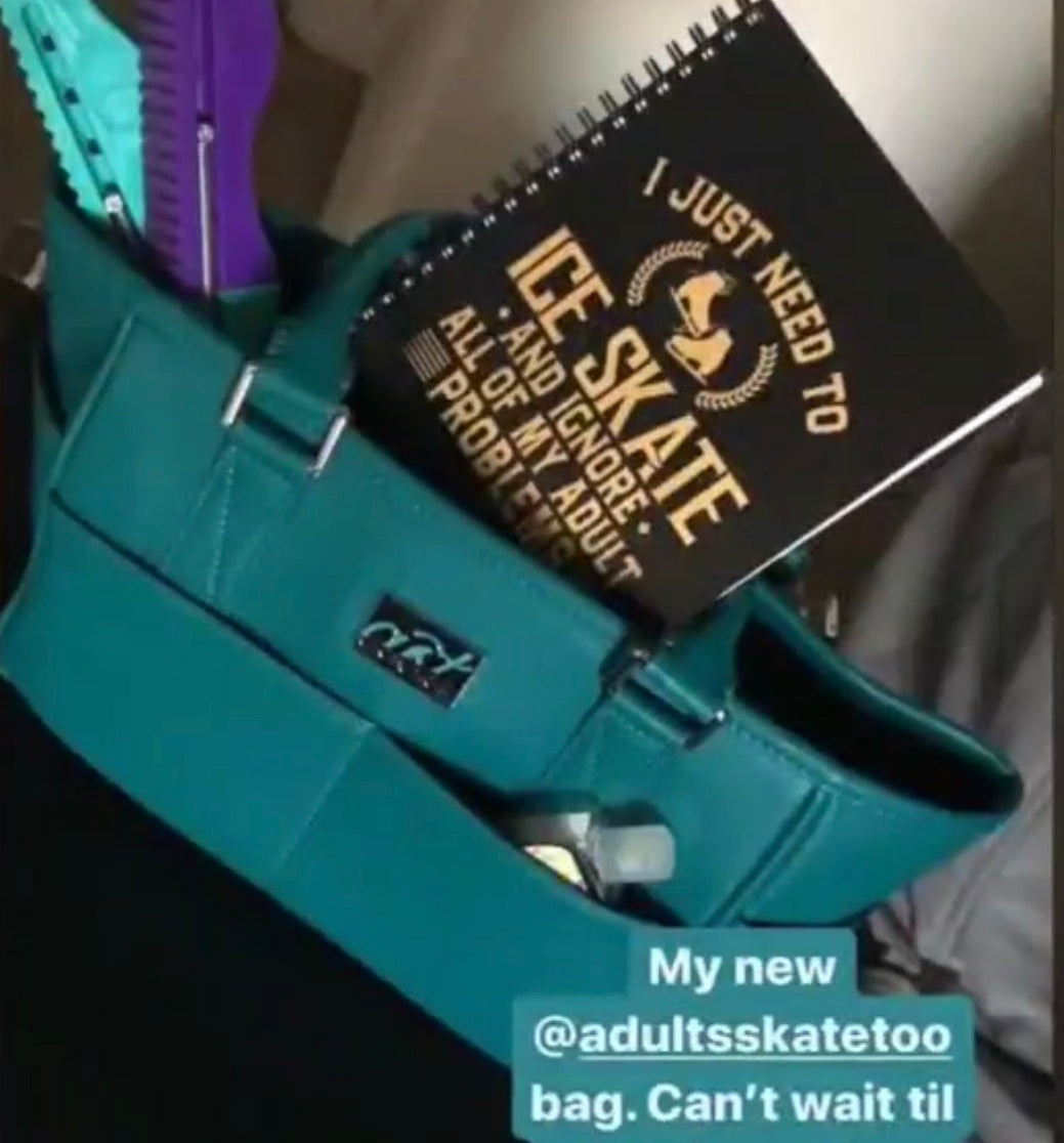 Teal bag with a notebook labeled 'I Just Need to Ice Skate' and text expressing excitement about bringing it to the rink.