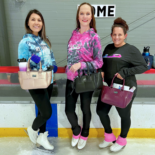 ice skaters holding totes