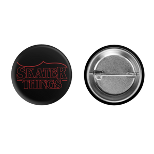 Button badge with 'Skater Things' text on a black background