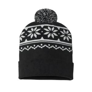 Black beanie with white snowflake pattern and pom-pom on a white background