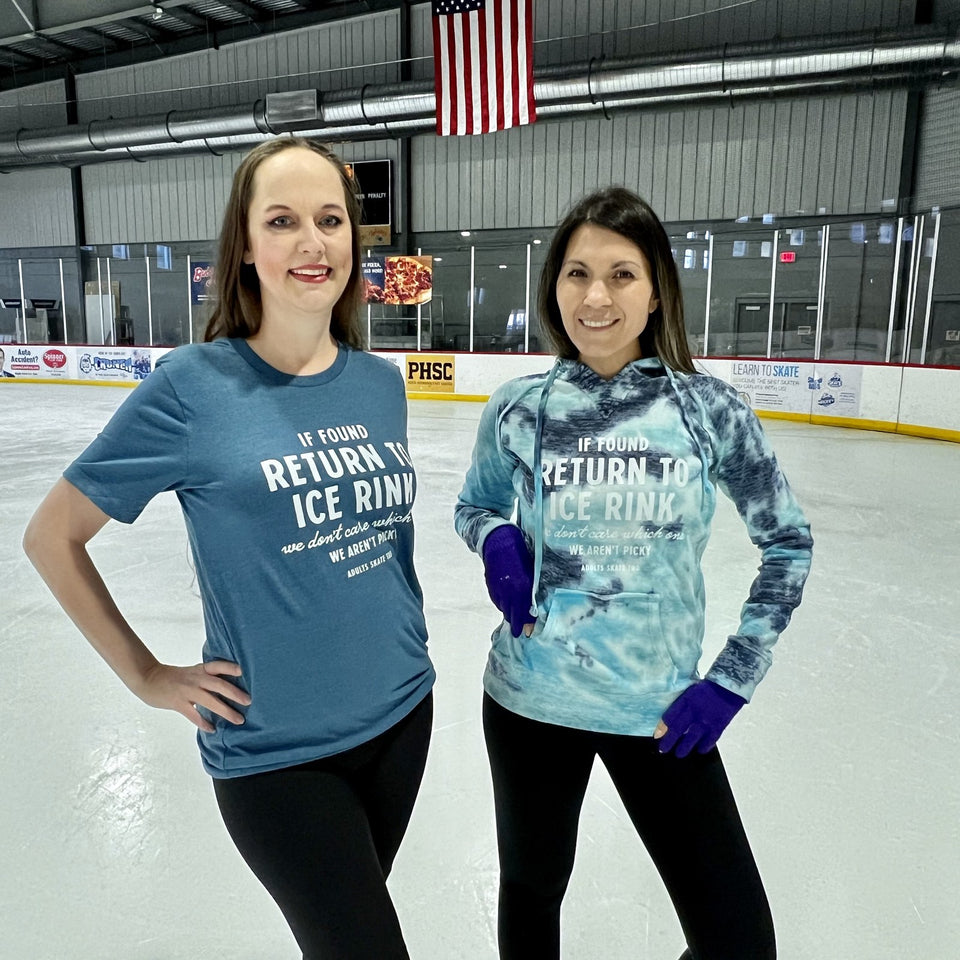 Two skaters on the ice in the If Found Return to Ice Rink tee and hoodie