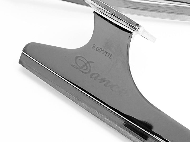 A figure skating blade on white, seen from the side with the engraving showing
