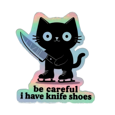 Holographic sticker of a black cat holding a knife with text 'be careful i have knife shoes' on a white background